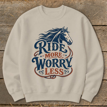 Cream sweatshirt with navy and red "Ride More Worry Less" text and horse graphic.