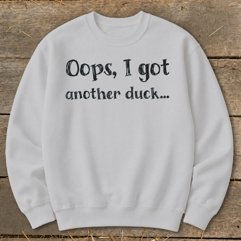 White sweatshirt with black text "Oops, I got another duck..."