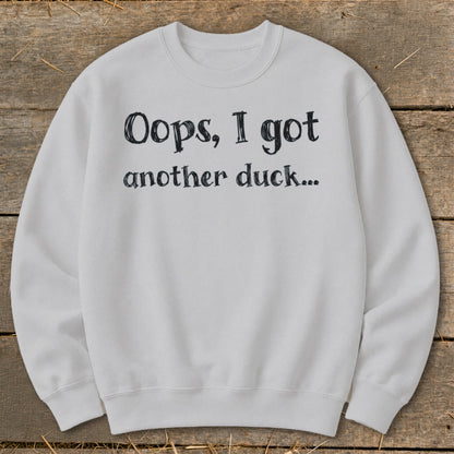 White sweatshirt with black text "Oops, I got another duck..."