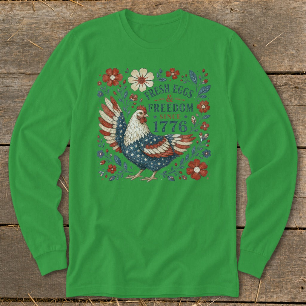 Green long-sleeved shirt with a patriotic chicken graphic and text reading "Fresh Eggs & Freedom Since 1776".
