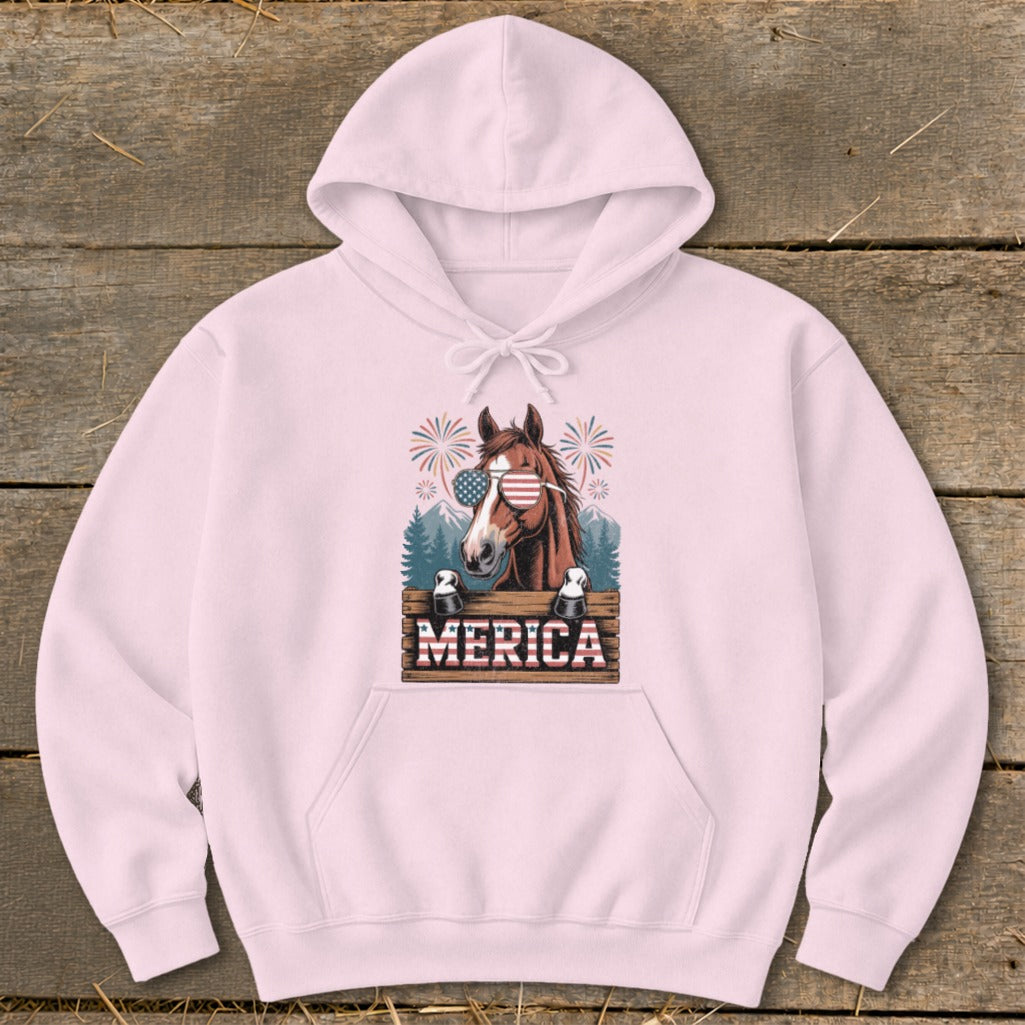 Pink hoodie with a brown horse wearing American flag sunglasses and "Merica" text.