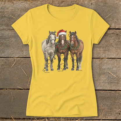 Three horses decorated with Christmas lights and a Santa hat.