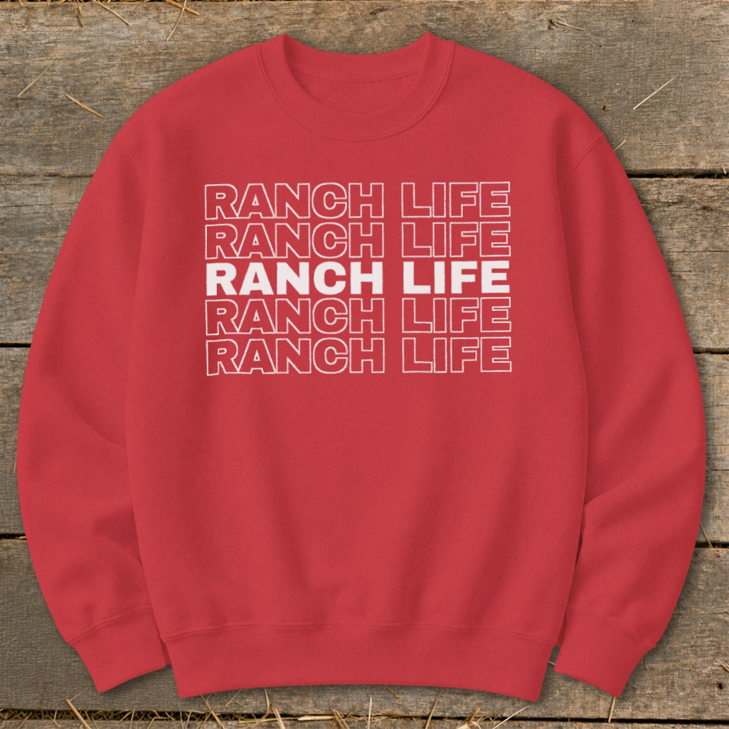 A red crewneck sweatshirt featuring the text Ranch Life repeated in stacked white outlined letters.