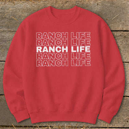 A red crewneck sweatshirt featuring the text Ranch Life repeated in stacked white outlined letters.