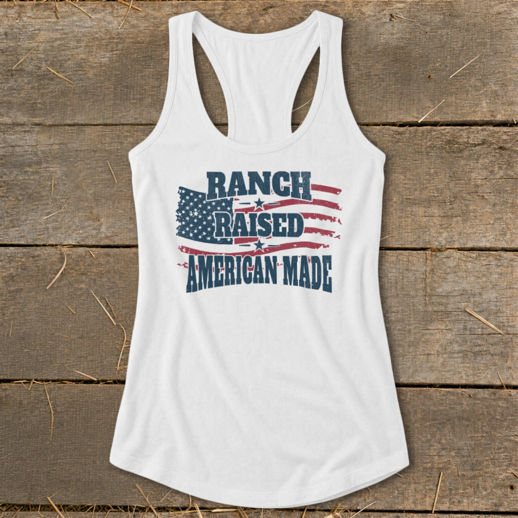 White tank top with distressed American flag and text: Ranch Raised American Made.