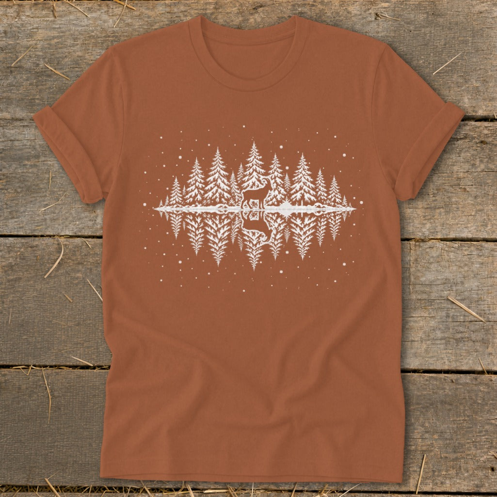 Orange t-shirt with white pine trees, deer, and reflection graphic.
