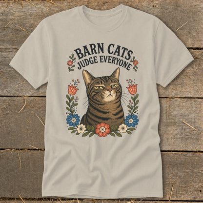 T-shirt with a tabby cat surrounded by flowers and the text "BARN CATS JUDGE EVERYONE".