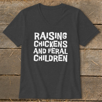 Dark grey t-shirt with white text reading "Raising Chickens And Feral Children".