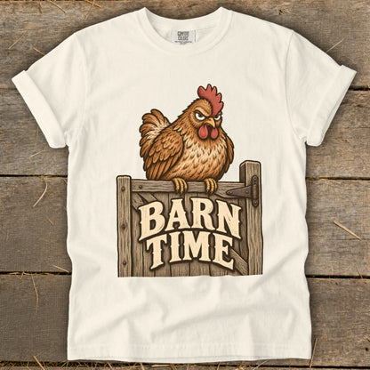 White t-shirt with angry cartoon chicken sitting on wooden gate, text "BARN TIME".