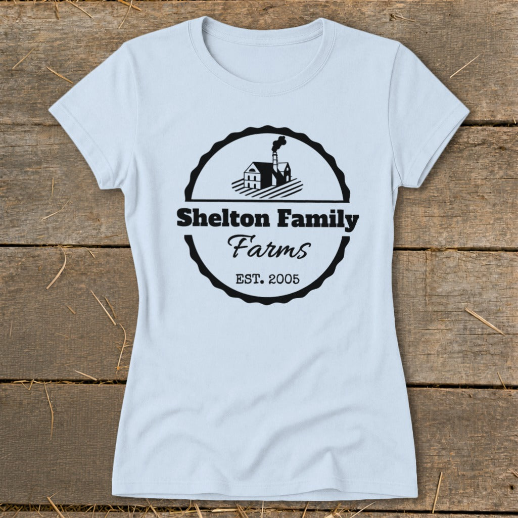 Light blue t-shirt with black Shelton Family Farms logo including a house and EST. 2005.