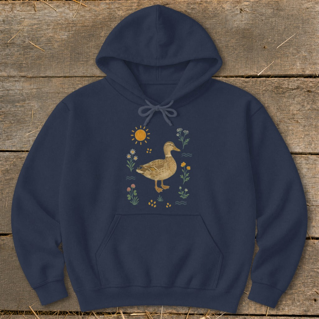 Navy hoodie with a stylized duck surrounded by sun and wildflowers.