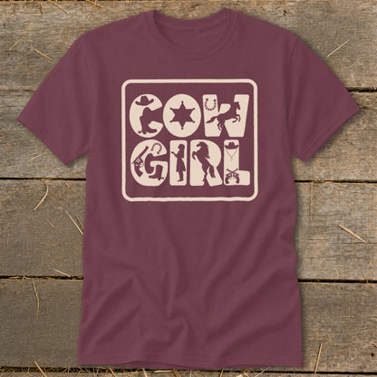 Maroon t-shirt with cream "COWGIRL" text surrounded by western-themed silhouettes.