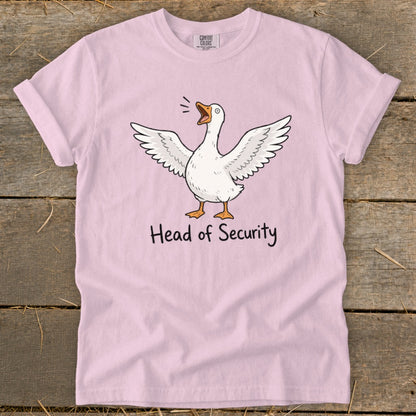 Pink t-shirt with white cartoon goose and the text "Head of Security".