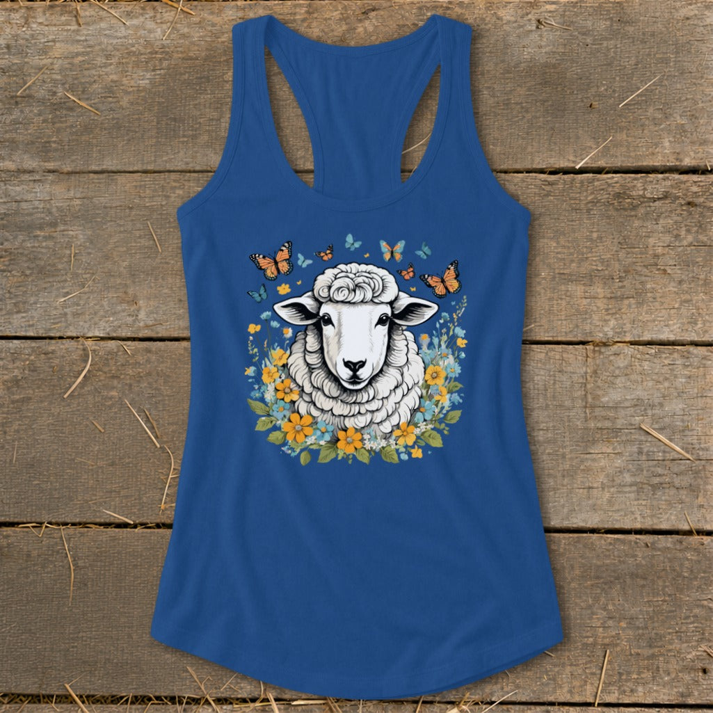Blue tank top with sheep and butterflies graphic surrounded by flowers.