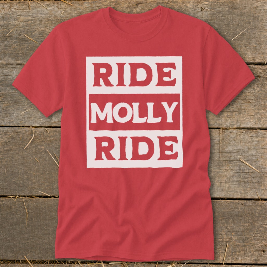 A red crewneck t-shirt featuring the white text RIDE MOLLY RIDE on a wooden background.