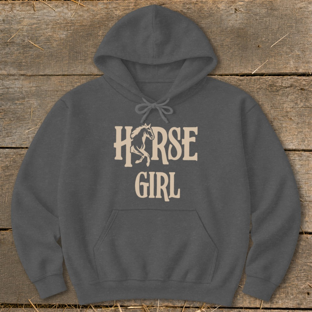 Dark grey hoodie with "Horse Girl" text and horse graphic on a wooden background.