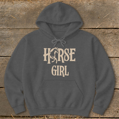 Dark grey hoodie with "Horse Girl" text and horse graphic on a wooden background.
