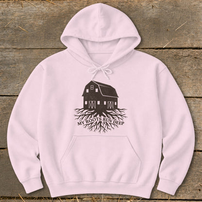 Pink hoodie with a dark barn and roots graphic and the text "MY ROOTS RUN DEEP".