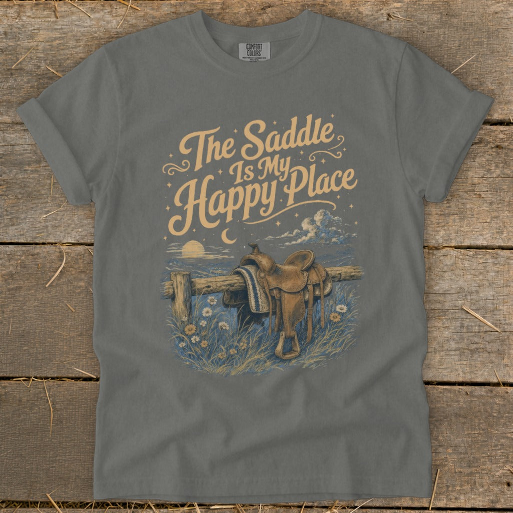 T-shirt with "The Saddle Is My Happy Place" text and saddle on a fence.