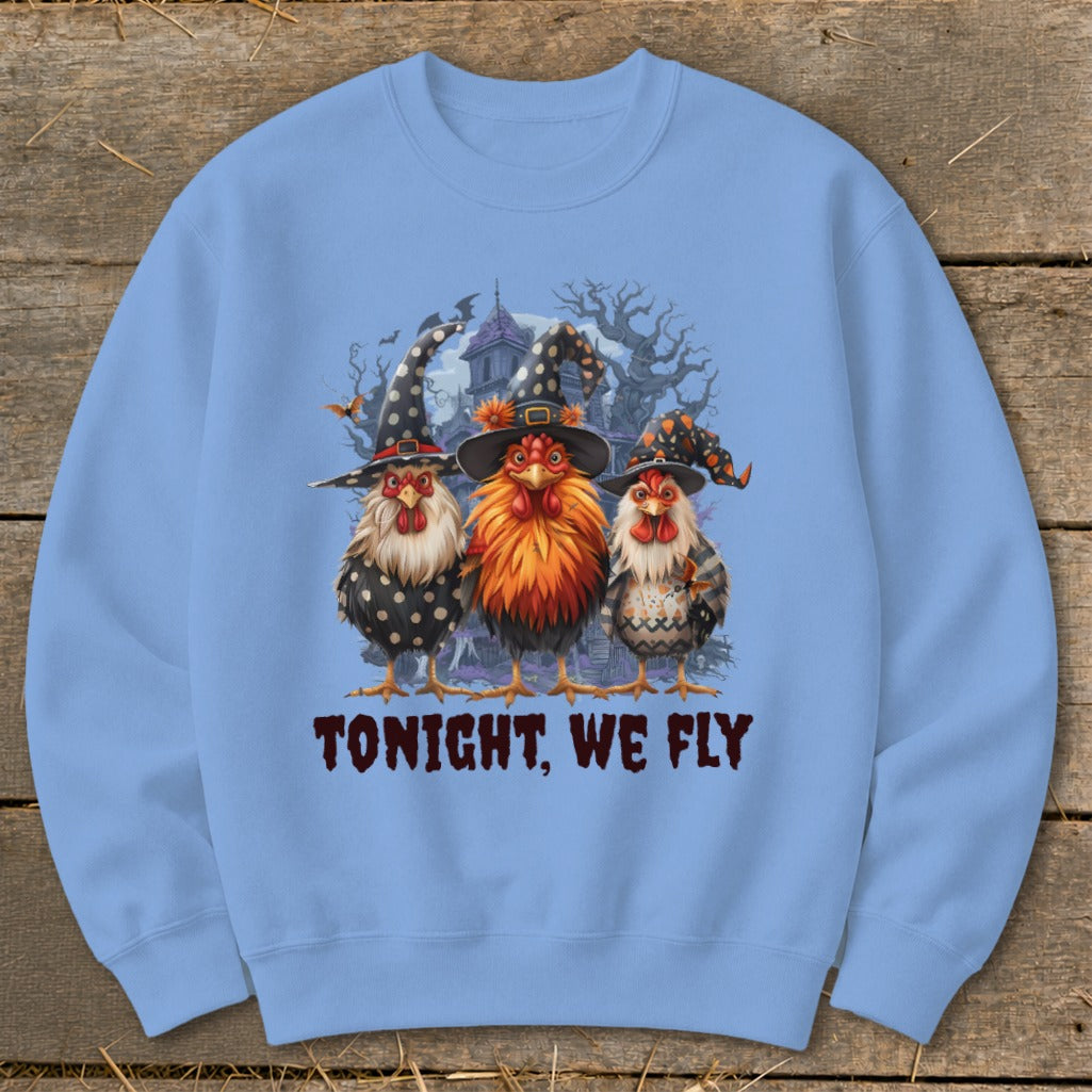 Three chickens wearing witch hats, with text "TONIGHT, WE FLY".