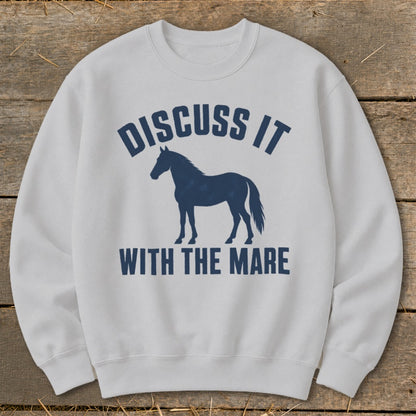 Light grey sweatshirt with navy blue text "Discuss It With The Mare" and horse silhouette.