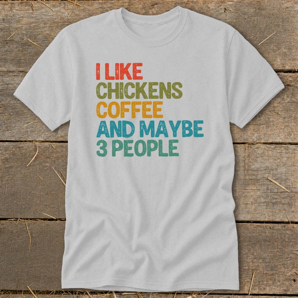 White t-shirt with text "I LIKE CHICKENS COFFEE AND MAYBE 3 PEOPLE".