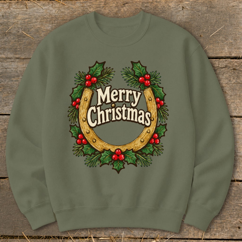 Green sweatshirt with a horseshoe and holly wreath graphic saying "Merry Christmas".