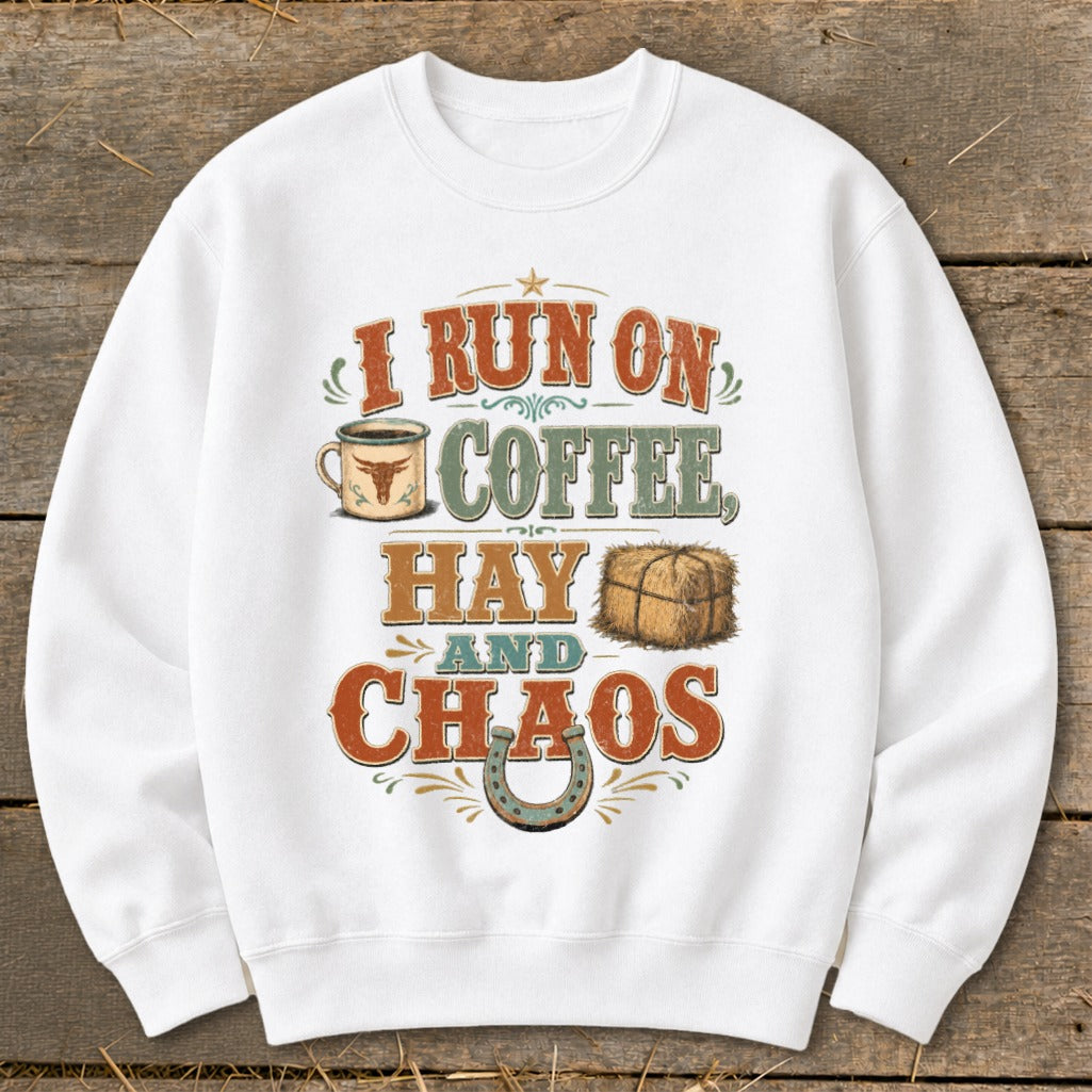 White sweatshirt with "I Run On Coffee, Hay and Chaos" text and graphics.