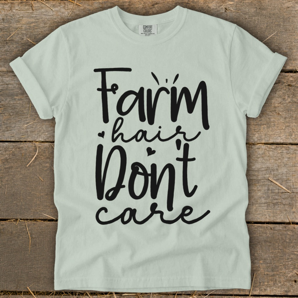 Light blue t-shirt with black text: "Farm hair don't care."