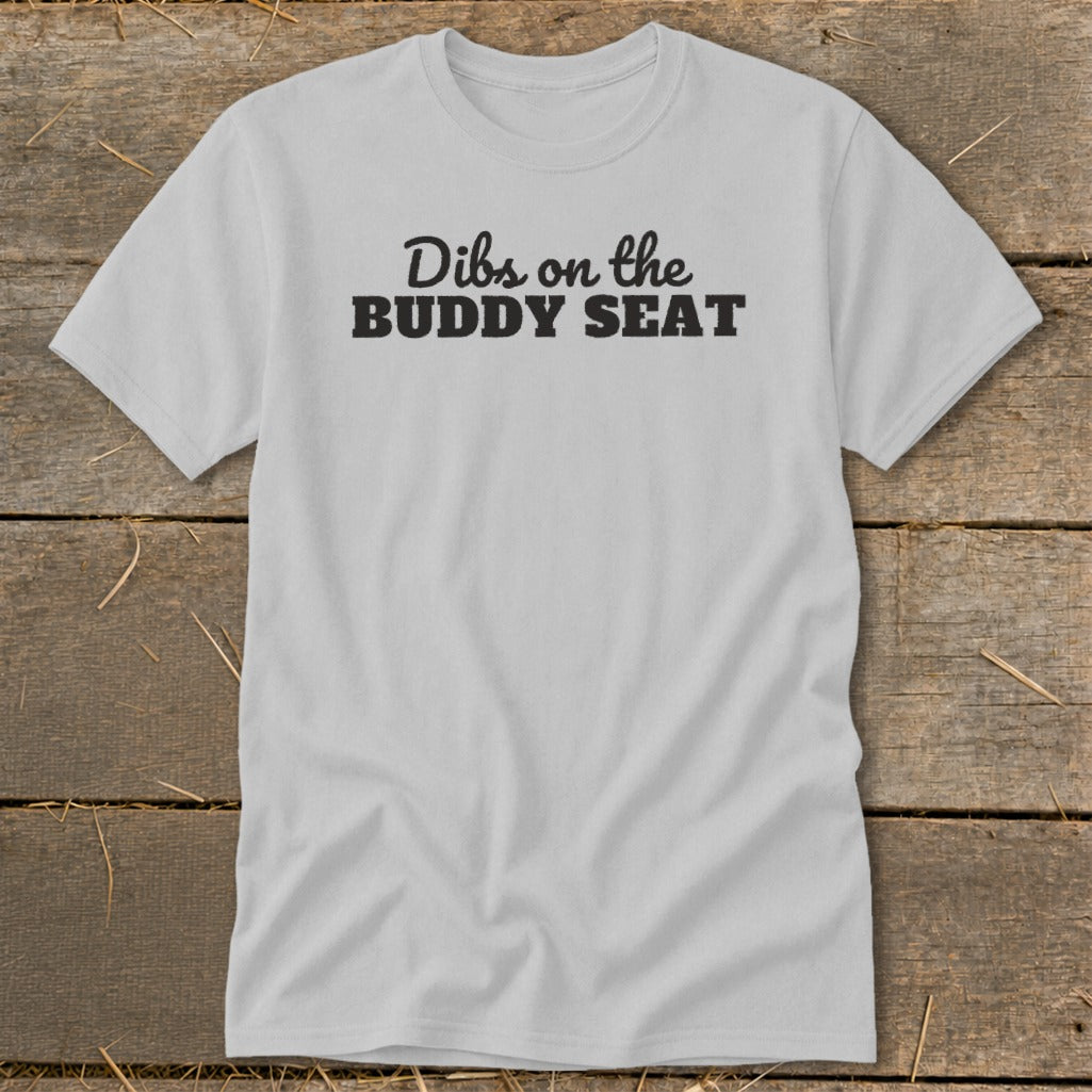 Light gray t-shirt with black text reading "Dibs on the BUDDY SEAT".