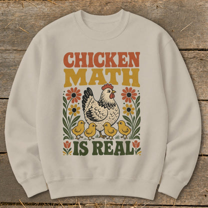 Cream sweatshirt with "Chicken Math Is Real" text, hen, and chicks illustration.