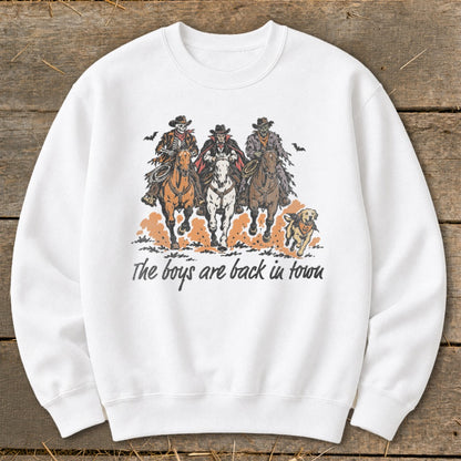Three skeleton cowboys ride horses with a dog, text reads "The boys are back in town."