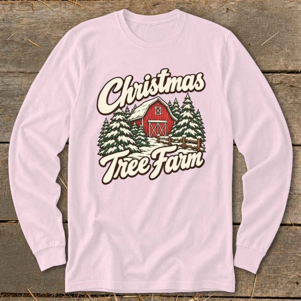 Long sleeve pink shirt with Christmas Tree Farm barn graphic.