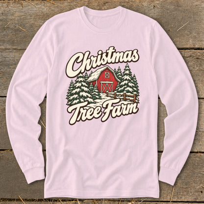 Long sleeve pink shirt with Christmas Tree Farm barn graphic.