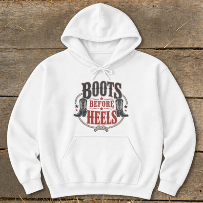 White hoodie with "Boots Before Heels" graphic featuring cowboy boots and rope detail.