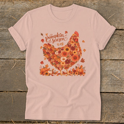 Pink t-shirt with floral chicken and "Pumpkin Season" text, surrounded by pumpkins and leaves.