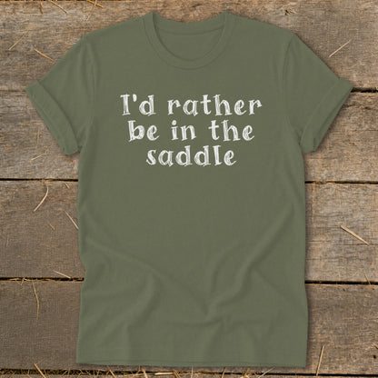 Olive green t-shirt with white text reading "I'd rather be in the saddle."