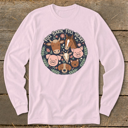 Pink long-sleeve shirt with a circular graphic of farm animals and text "FULL BARN, FULL HEART".