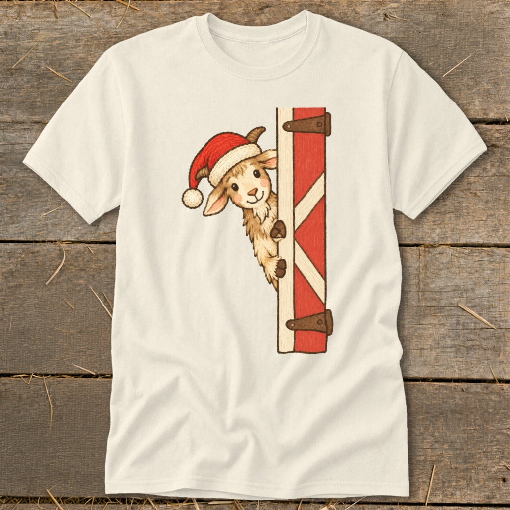 Cream t-shirt featuring a cute llama wearing a Santa hat peeking from behind a red barn door.