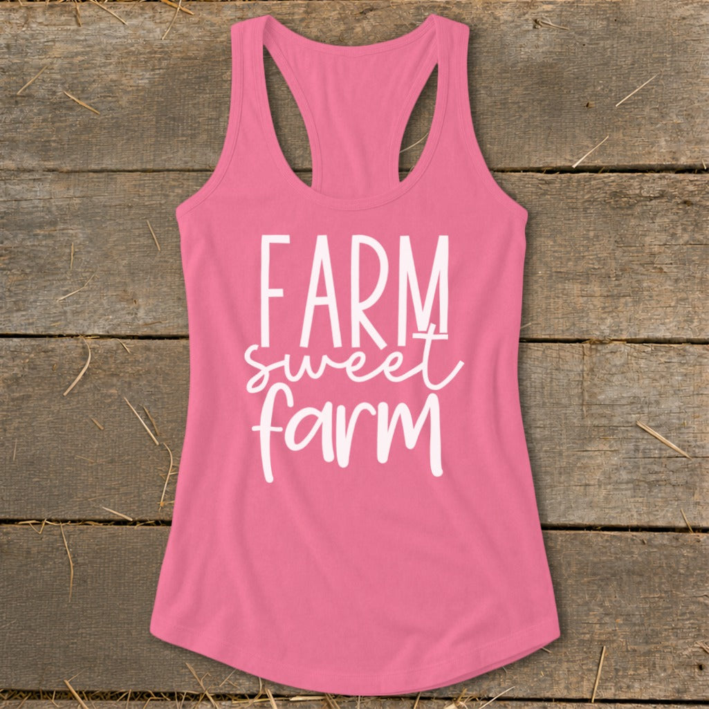 Pink racerback tank top with "Farm sweet farm" text in white.