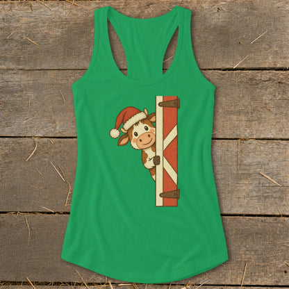 Green tank top with cartoon cow wearing Santa hat peeking from behind barn door.