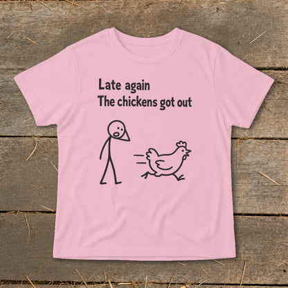 Pink t-shirt with text "Late again The chickens got out" and stick figure chasing a chicken.
