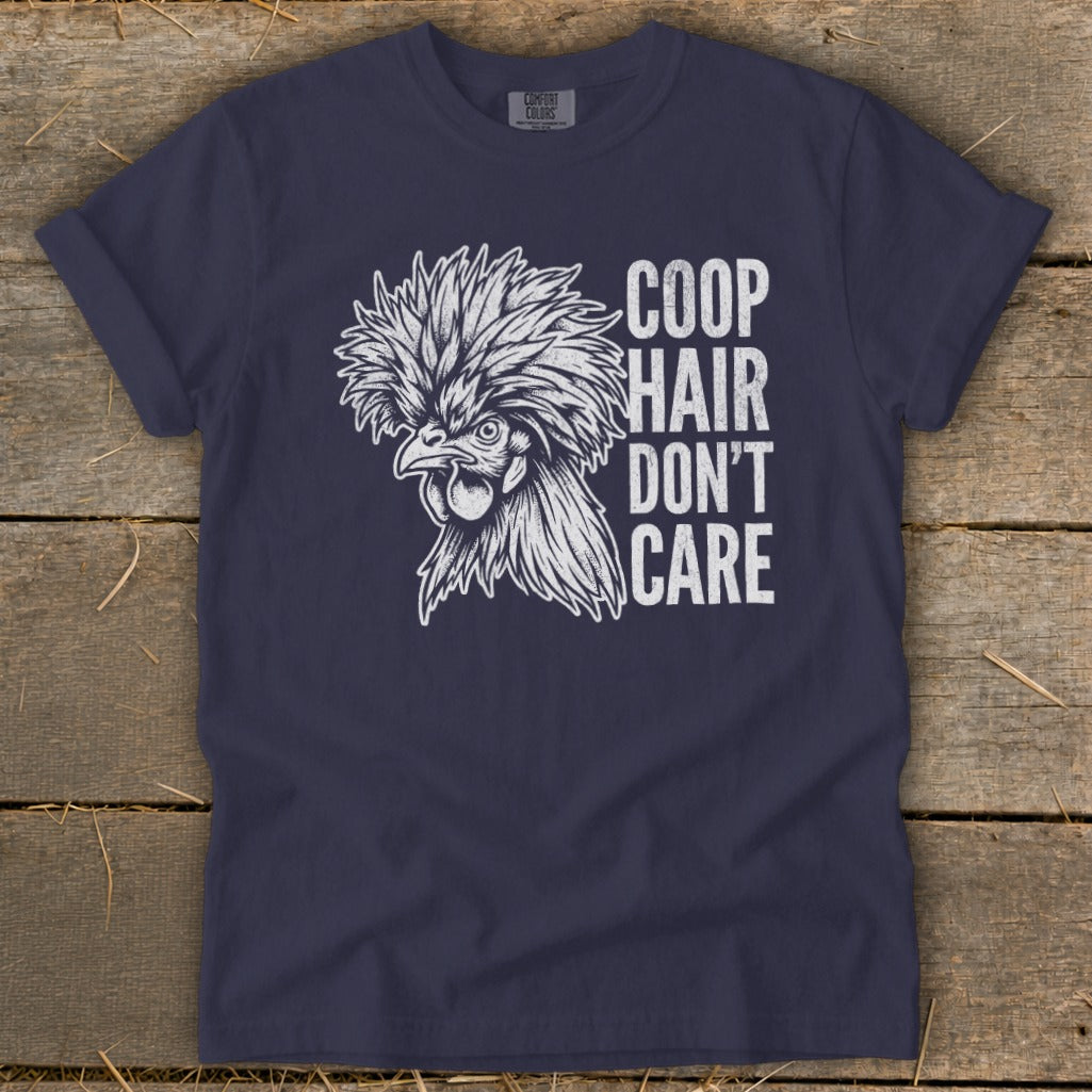 Dark navy t-shirt with a white graphic of a Polish chicken and text "COOP HAIR DON'T CARE".