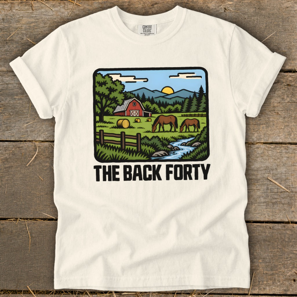 Off-white t-shirt featuring a cartoon illustration of a farm with horses and the text THE BACK FORTY.