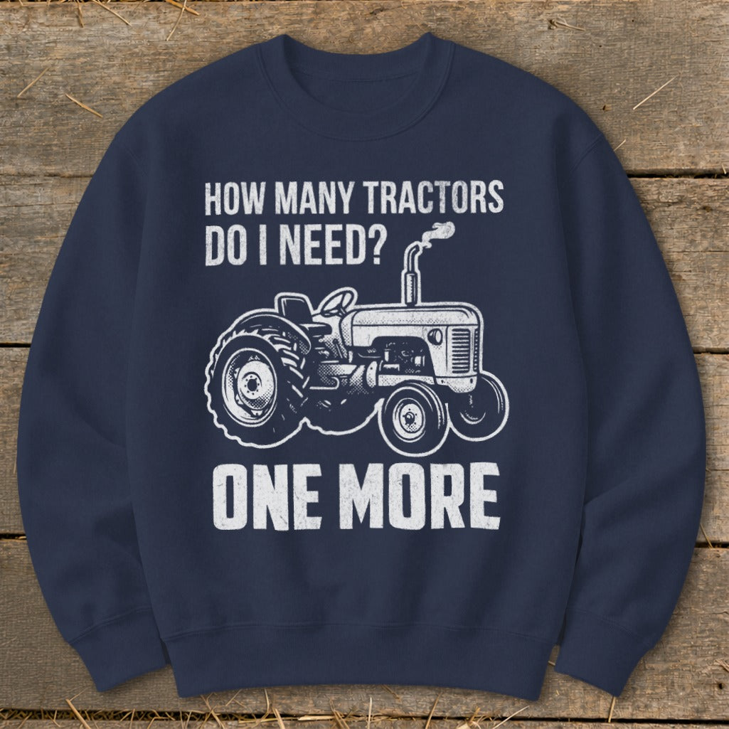 Navy sweatshirt with white graphic: "How many tractors do I need? One More"