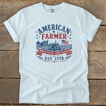 White t-shirt with American Farmer graphic, tractor, barn, and flag.