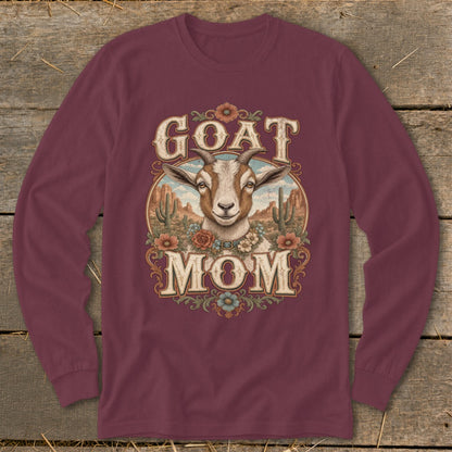 Maroon long-sleeve shirt with a goat and desert landscape design that says "GOAT MOM."