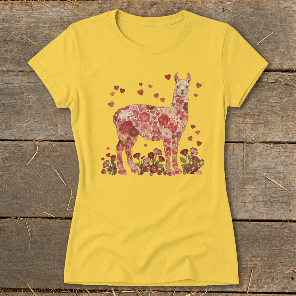 Yellow t-shirt with a floral llama graphic surrounded by hearts.