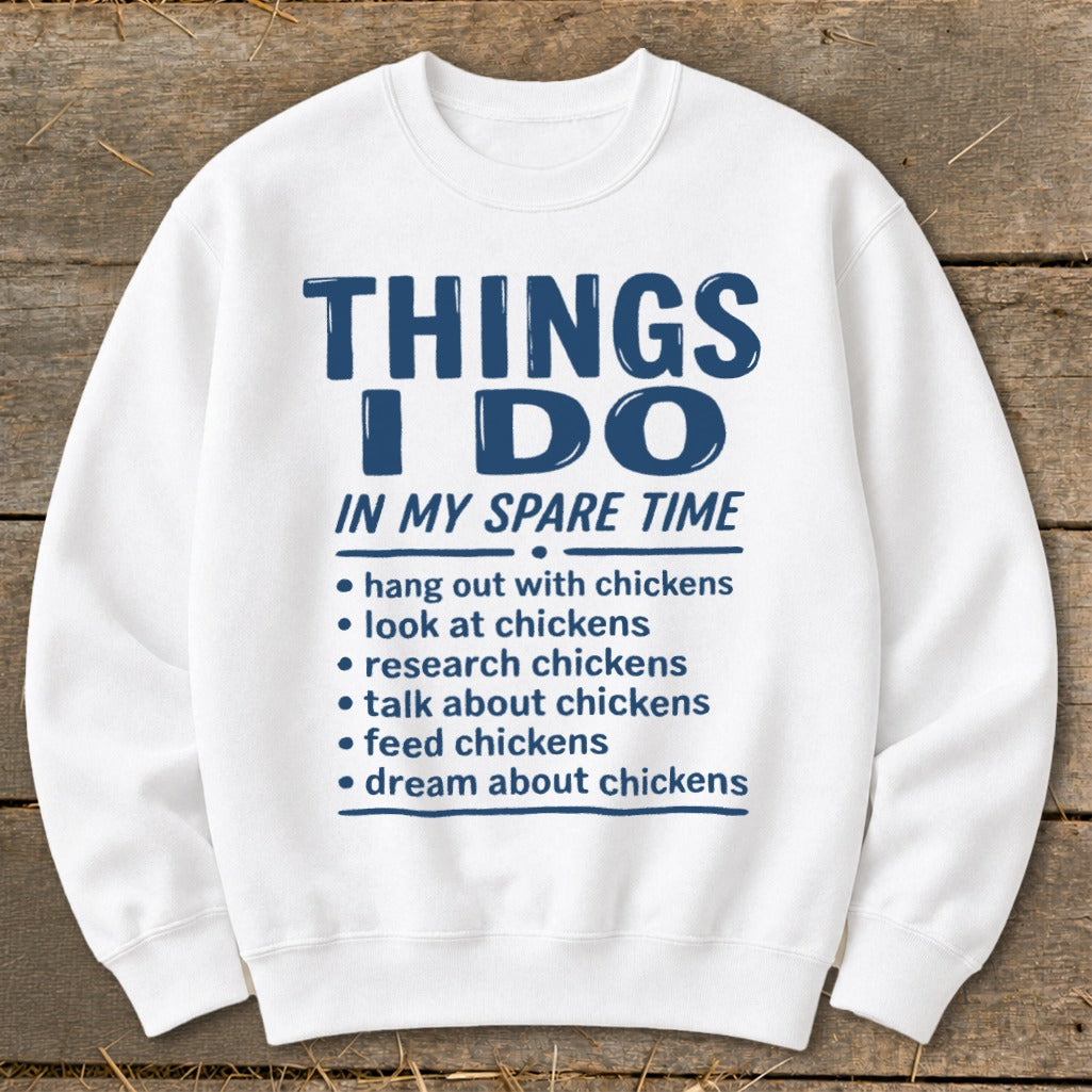White sweatshirt with blue text listing chicken-related spare time activities.