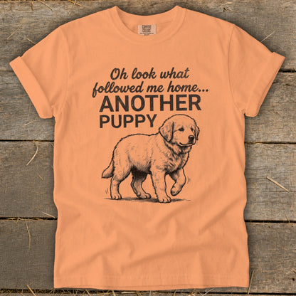 T-shirt with text "Oh look what followed me home... ANOTHER PUPPY" and a puppy illustration.